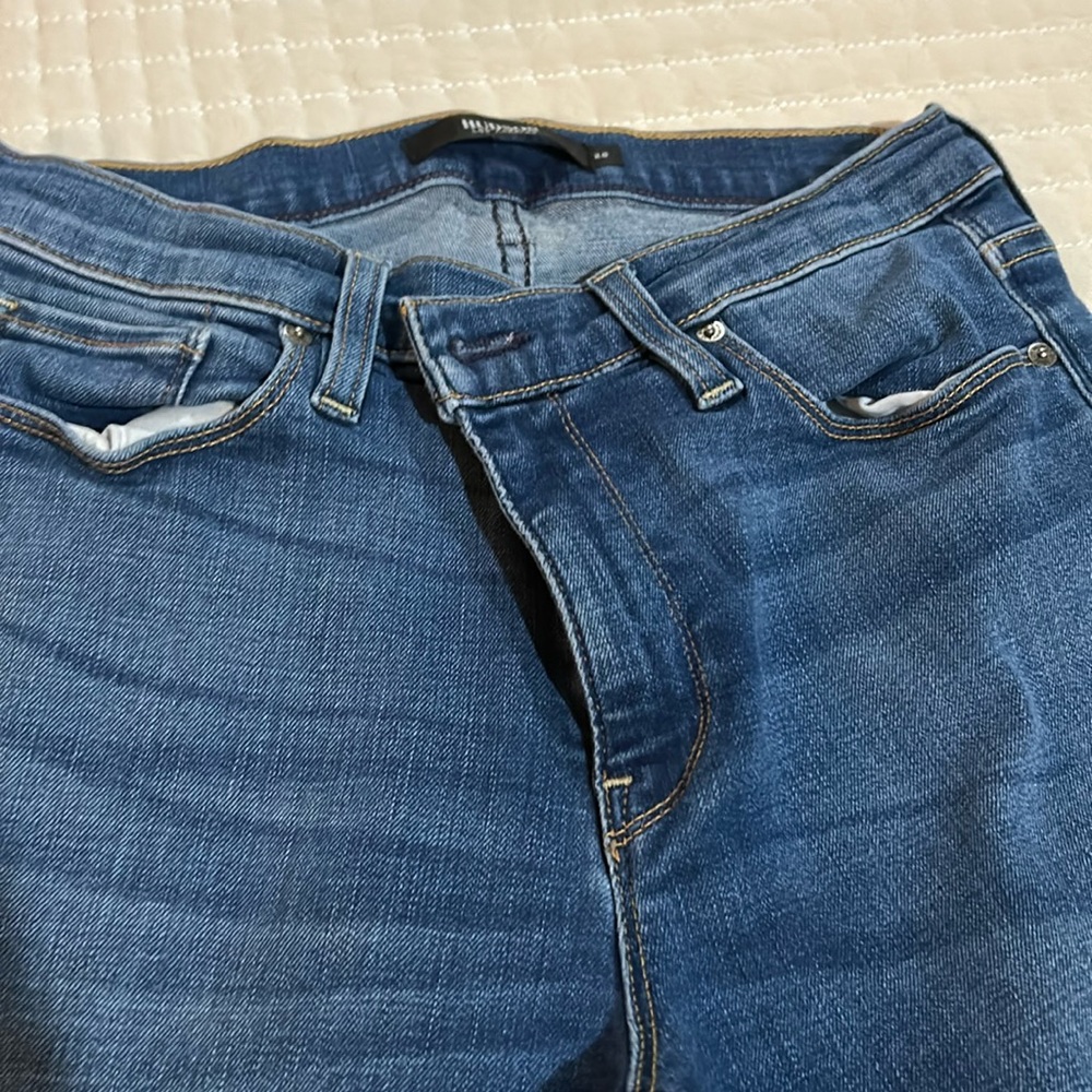 Hudson cropped lighter wash jeans.